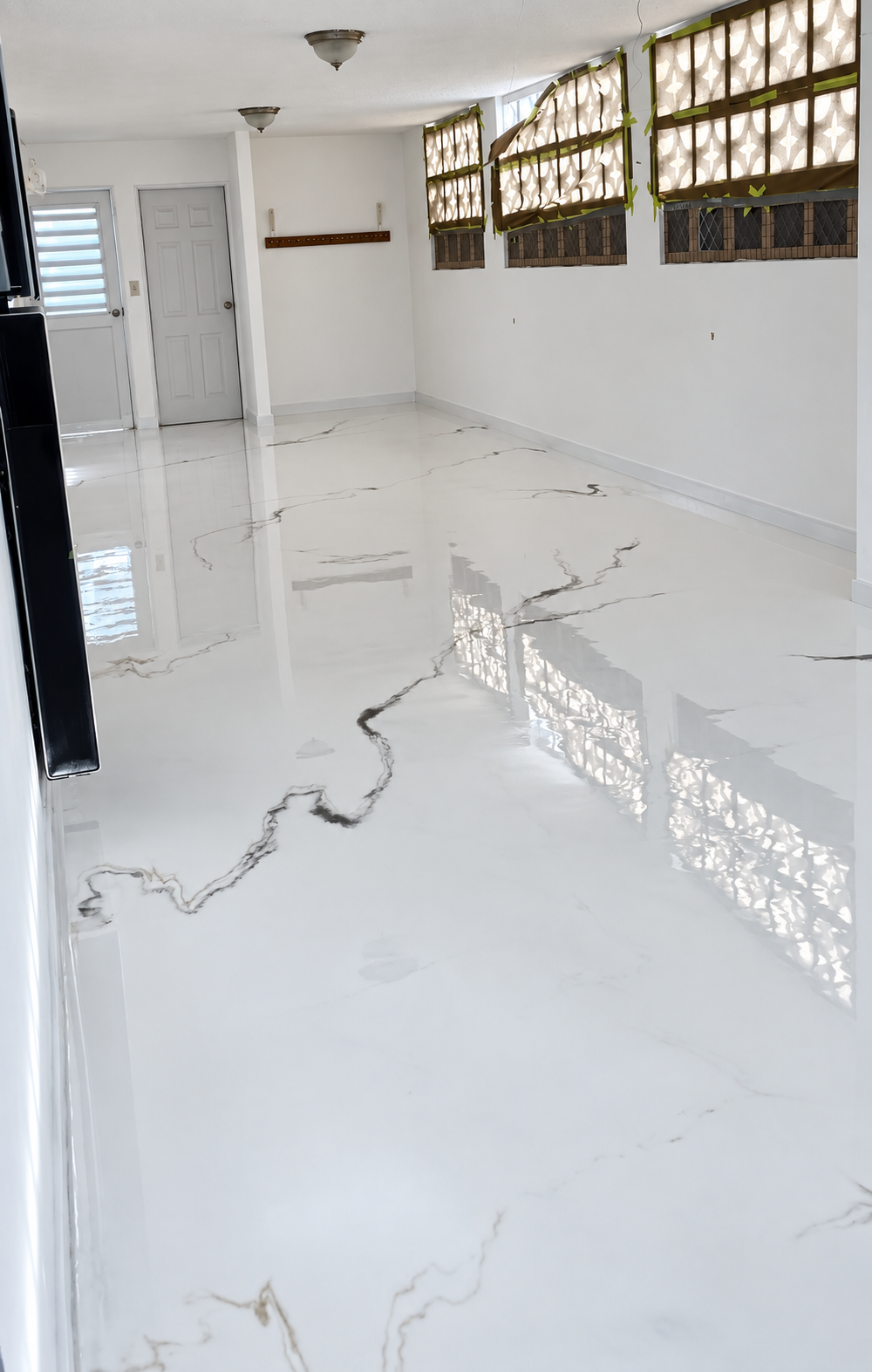 Finished white marble-look epoxy floor from the side