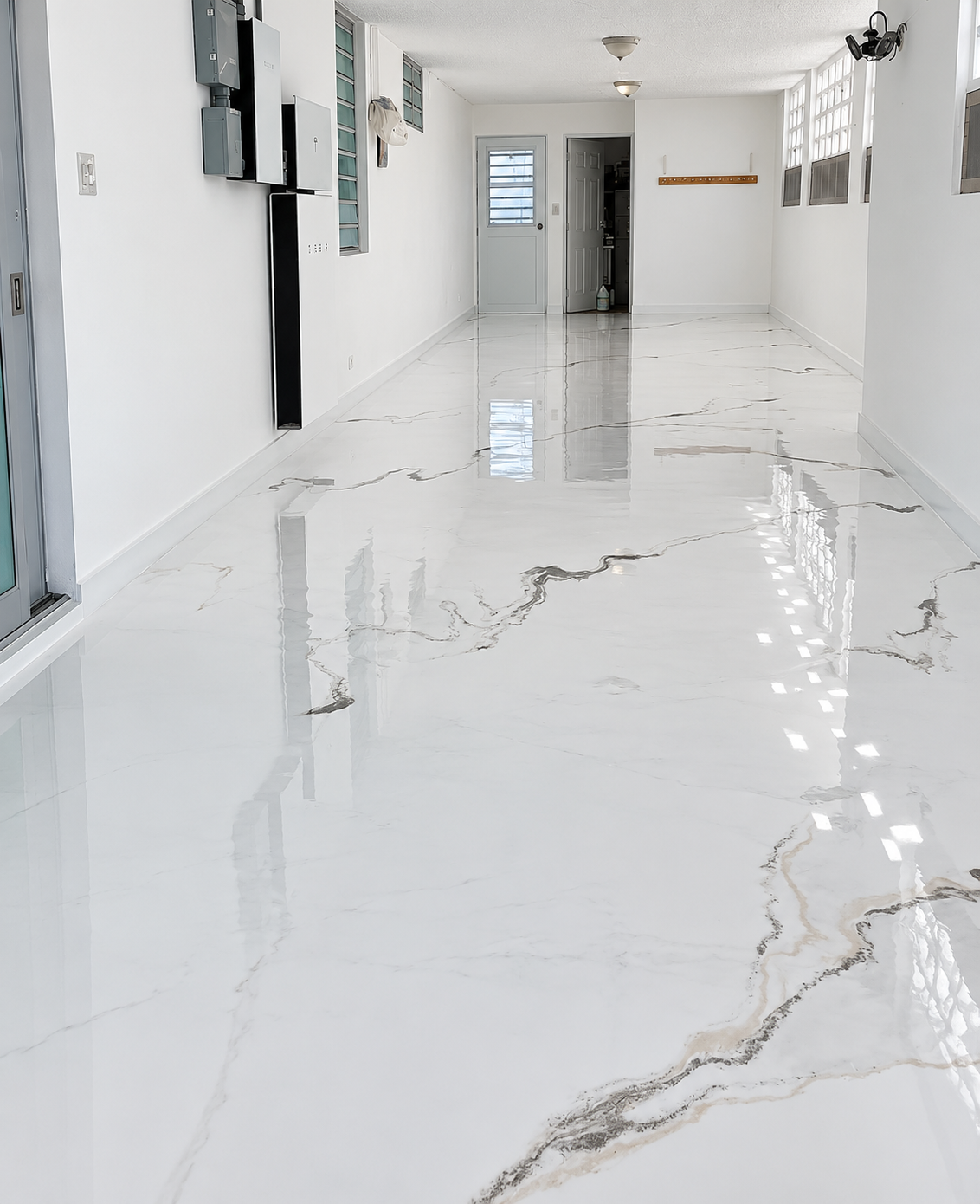 Completed white marble-look epoxy garage floor